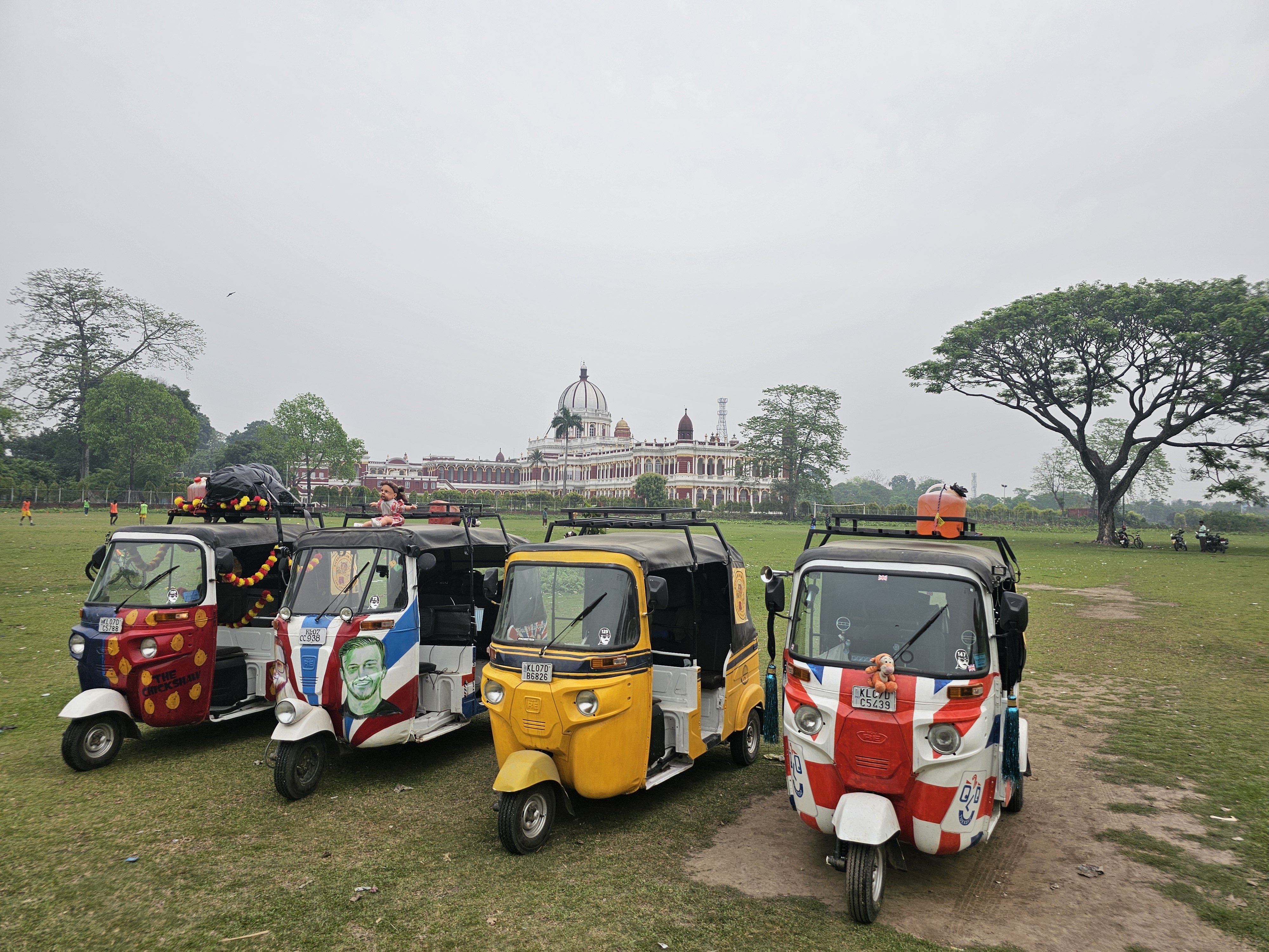 Colorful auto-rickshaws lined up for the Rickshaw Run in India